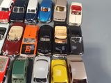 a lot of toy cars that are sitting on a table