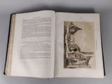 an open book with a picture of a building on it