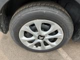 a close up of a tire on a car ' s rim