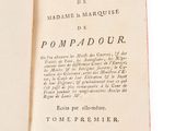 a book open on a white surface with a picture of a cat