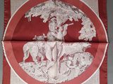 an image of a red and white handkerchief with a picture of a woman on a horse