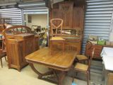 a table and chairs in a room with a lot of furniture