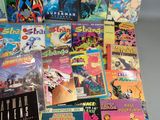 a lot of comic books that are on the table