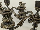 pair of antique brass candelabs with ornate designs