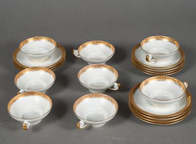 six cups and a saucer on the table