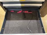 a tool box with a pair of pliers inside of it