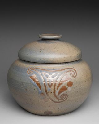an image of a ceramic jar with a lid