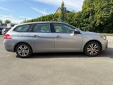 a picture of a silver car parked in a parking lot