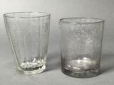 two glasses sitting next to each other on a table