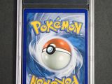 a close up of a card with a pokemon ball on it