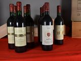 several bottles of wine are lined up on a table