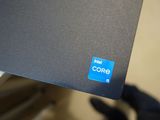 a close up of a computer screen with a blue core sticker on it