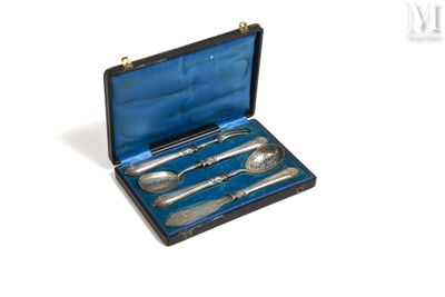a silverware set in a black case on a white surface