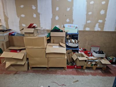 a pile of boxes sitting on the floor in a room