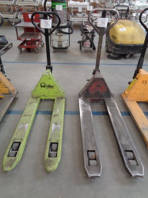 a lot of different types of pallets in a warehouse
