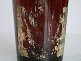 a close up of a glass with a rusted surface