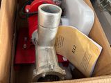 a cardboard box with a metal object inside of it