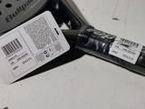 a close up of a tennis racket with a price tag on it