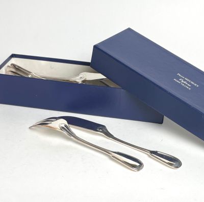 two forks and a spoon in a blue box