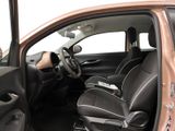 the interior of a car with the door open and the driver ' s seat up