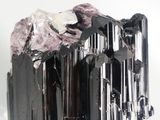 black and white crystals on a stand on a white surface
