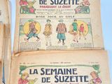 three old french children ' s comics are on display on a table