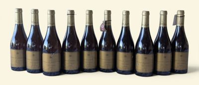 six bottles of wine are lined up in a row on a white surface