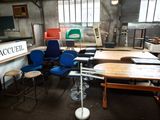 a room with a lot of chairs and tables in it