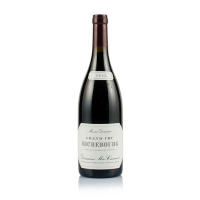 a bottle of wine that is sitting on a table