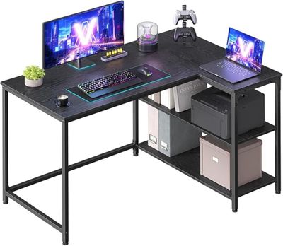 a computer desk with two monitors and a keyboard on it