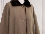 brown coat with black fur collar and cuffs on mannequin dummy