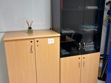 a cabinet with a glass door next to a cabinet with a glass door