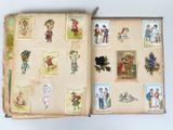 an open book with pictures of people and animals on it