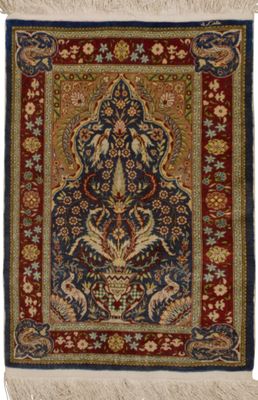a blue and red rug with a floral design on it