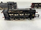 three model trains that are sitting on a table