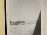 a black and white photo of an airplane flying in the sky