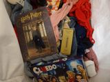 a pile of harry potter items on a bed