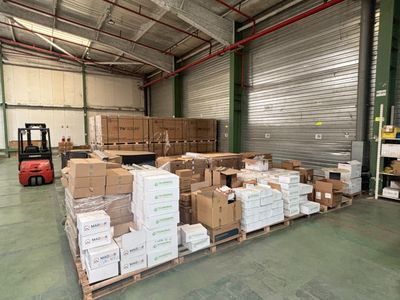 a large warehouse filled with lots of boxes and pallets