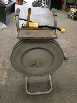 a small machine that is sitting in a garage