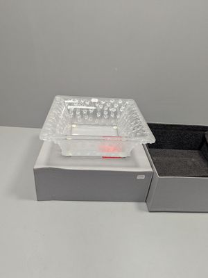 a box of pills and a tray of pills on a table