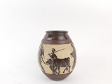a brown vase with a picture of a man on a horse