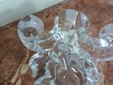 two glass ashtrays on a marble counter top