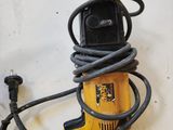 a corded drill and a corded cord on the wall