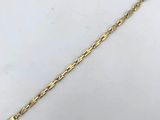 a gold bracelet with a long chain and a clasp