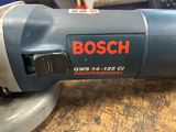 the bosch gws 14 - 125 orbital sander is being used on a table