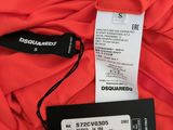 a close up of a red shirt with a price tag on it