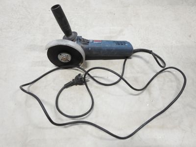 a small electric grinder with a cord attached to it