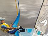 a painting of a man on a sailboat in the water