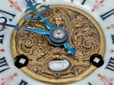 a close up of a clock with roman numerals on it