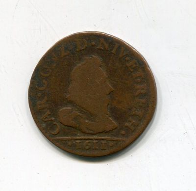 une vieille pièce de monnaie sur laquelle figure l'image d'un homme